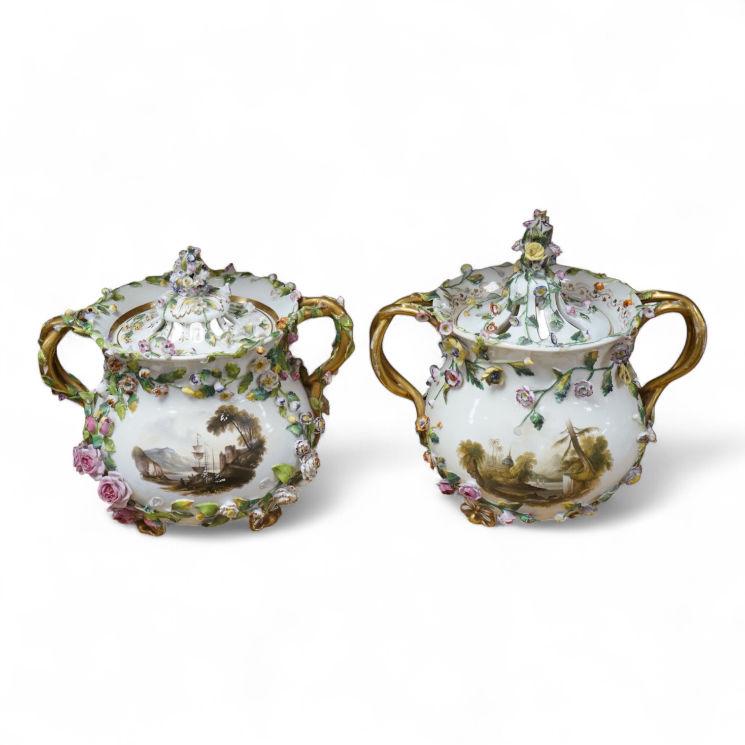 A pair of Rockingham two handled pot pourri vases and covers, c.1830-42, the first painted with two named views near Lyme, Dorsetshire and Stockly Bridge’, The second with an unnamed view of a monument by a lake, the rev